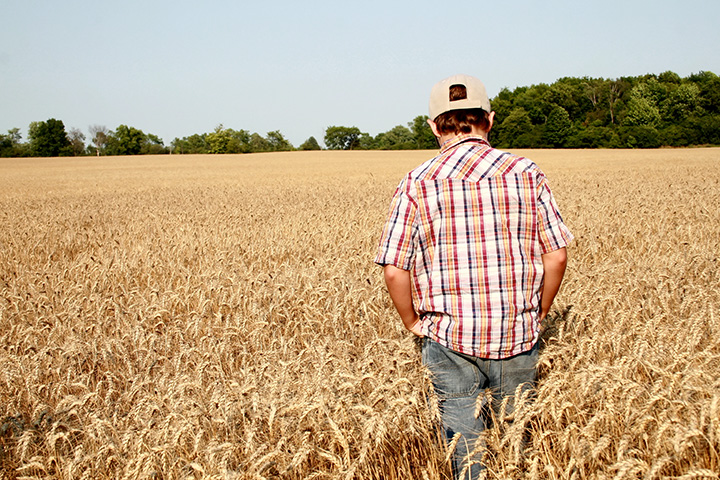 Young land borrower of Premier Farm Credit on their land financed by Premier Farm Credit through their young farmer loan program (image may be a child. Could we find a man in his 20’s or 30’s?)